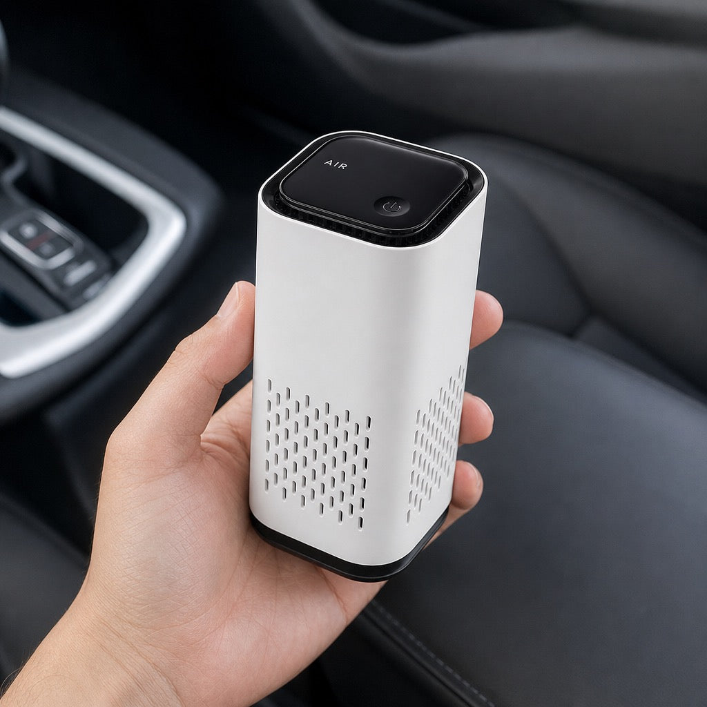 PureCabin FreshDrive handheld size reference - compact car air purifier